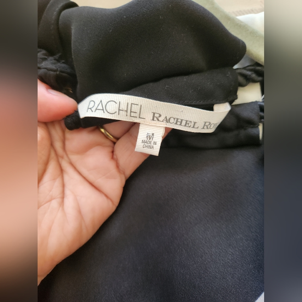 Sleevless triangle bottom finish . Size medium black and cream dress. - Picture 6 of 6